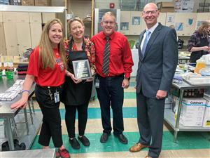 2022 CTE Teacher of the Year named. Pictured with administrators.